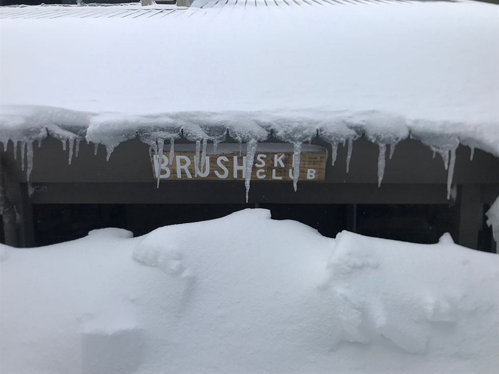 B'Rush Ski Club sign in heavy snow