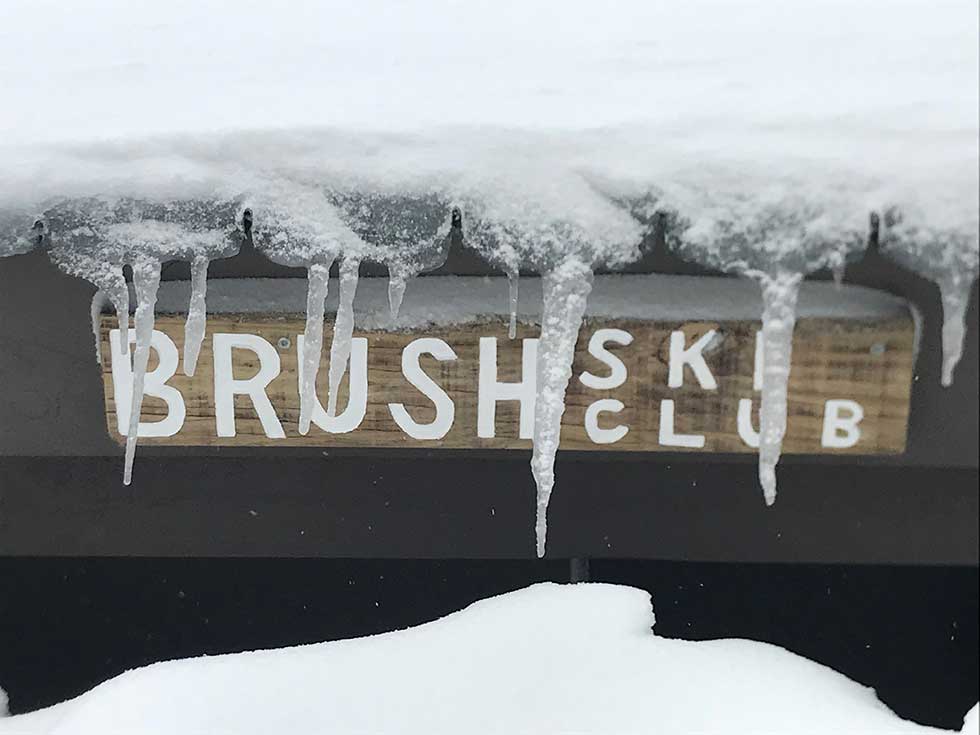 B'Rush Ski Club sign in heavy snow